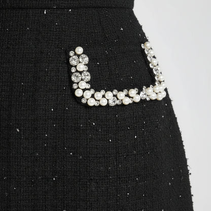 Prestige Tweed Jeweled Neckline Black Mini Dress.